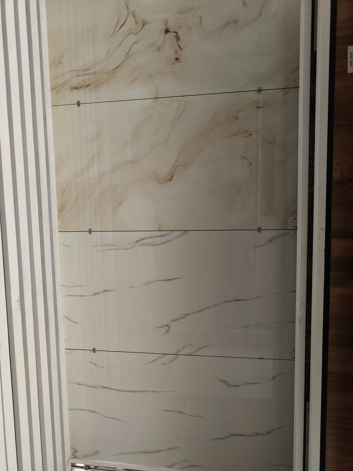 Cream glossy marble-effect large-format vitrified tile at Shri Tiles