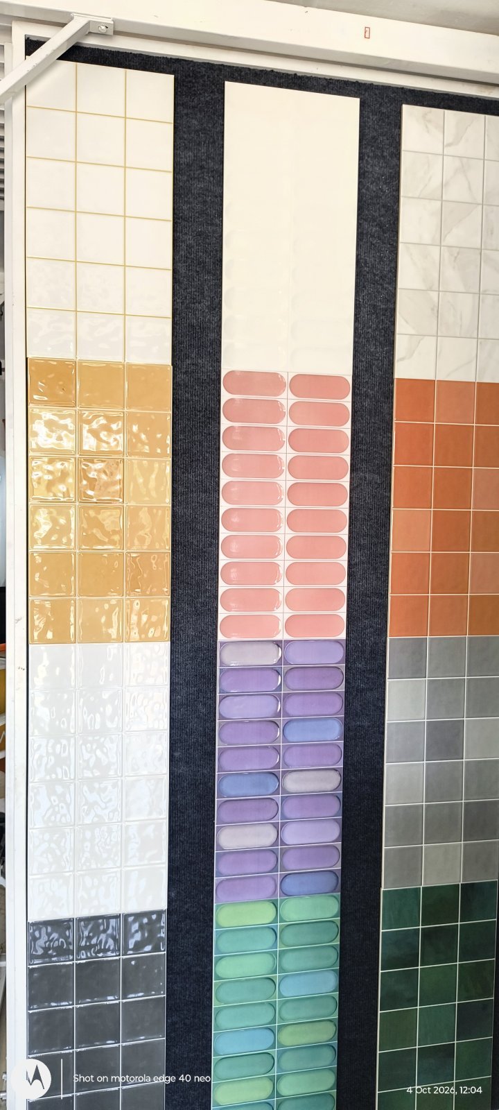 Colourful glazed wall tiles in orange, purple, teal and cream at Shri Tiles