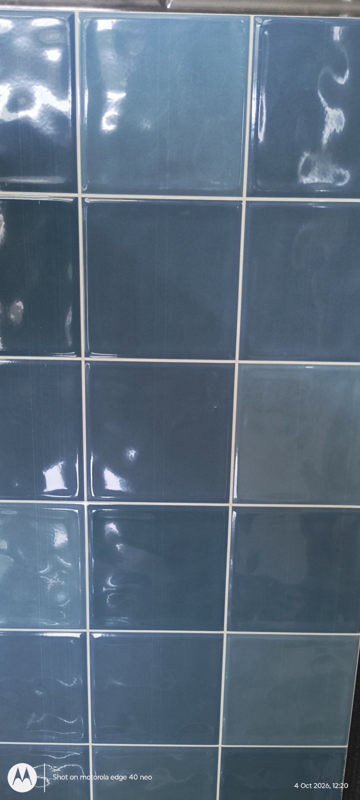 Glossy blue square wall tiles with white grout lines at Shri Tiles