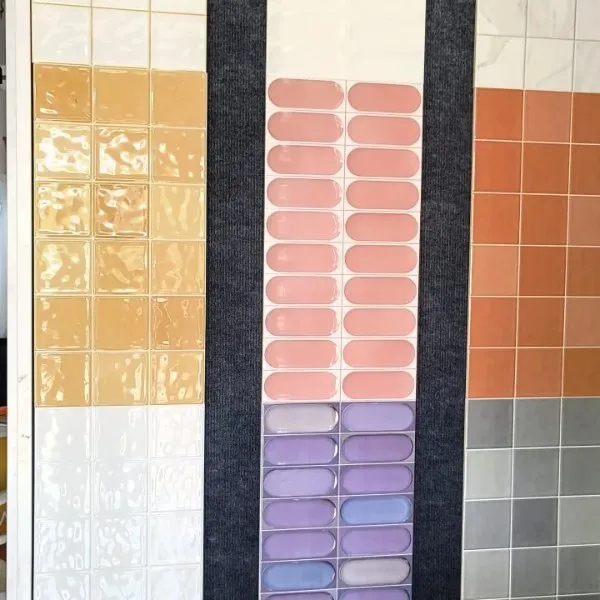 Colourful glazed wall tiles in orange, purple, teal and cream at Shri Tiles, Bengaluru