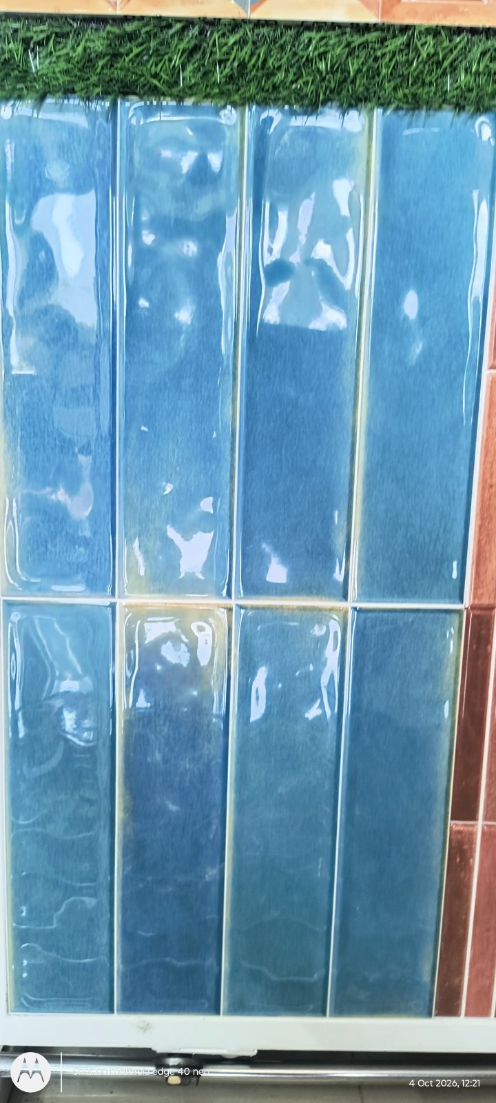 Wavy glazed blue rectangular wall tiles with a hand-glazed look at Shri Tiles