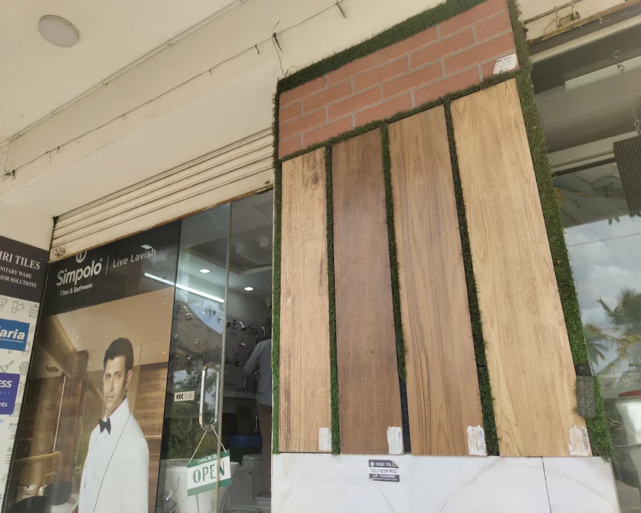 Wood-finish and brick-look tiles displayed at the Shri Tiles showroom entrance